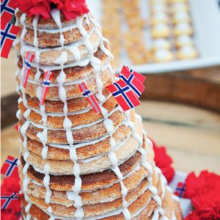 Kransekake — a cake made from almonds, sugar, and egg whites enjoyed on special occasions like Christmas and weddings — has a sweet structure: it gets its cone shape from many concentric rings stacked and held together with icing.