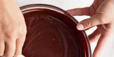 Pirzola. Pour. Stir. Those three basic steps are all there is to making an irresistible batch of ganache. Despite its French name, ganache is nothing elaborate 