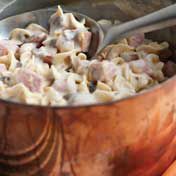 Emin to become a family favorite, this quick cooking casserole combines cubed cooked ham, noodles and tender onions blended with a creamy cheesy sauce.