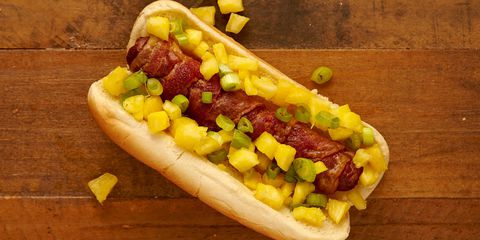 Vroče dogs are the quintessential pool food, but wrap the dog in bacon and top with chopped pineapples for a summery twist. Get the recipe from Delish.com.